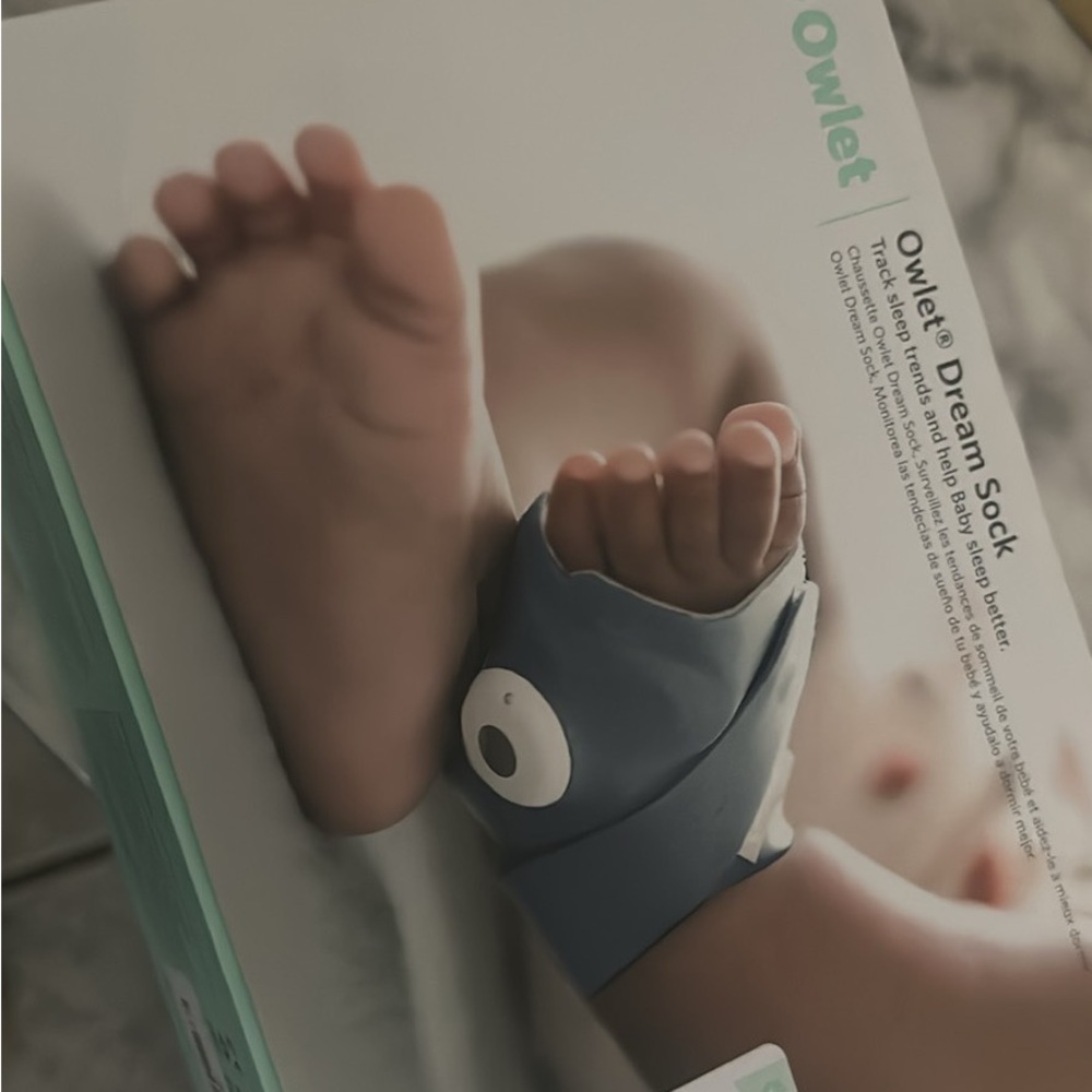 Blue Wearable Clip for Infants with Adjustable Strap and Compact Design